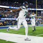 Seattle Seahawks quarterback Geno Smith (7) reacts on a touchdown during an NFL football game against the Los Angeles Rams, Sunday, Dec. 4, 2022, in Inglewood, Calif. (AP Photo/Kyusung Gong)