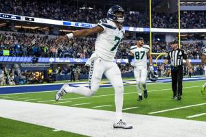 Seattle Seahawks quarterback Geno Smith (7) reacts on a touchdown during an NFL football game against the Los Angeles Rams, Sunday, Dec. 4, 2022, in Inglewood, Calif. (AP Photo/Kyusung Gong)