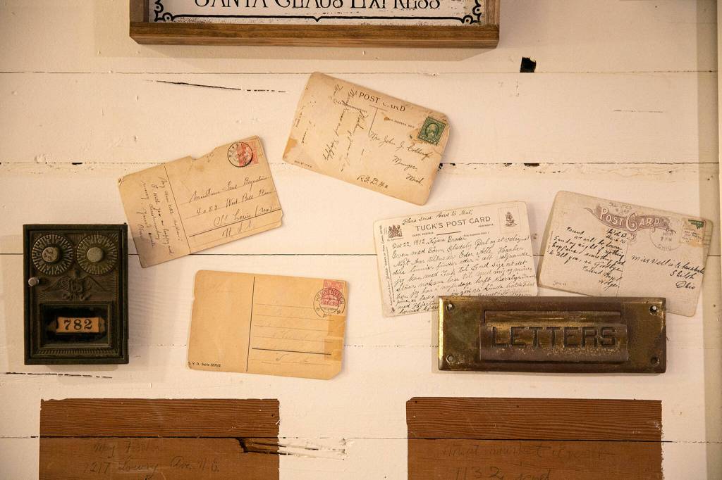 Relics of the Schultz households past as a post office still hang on the couples wall. (Ryan Berry / The Herald)