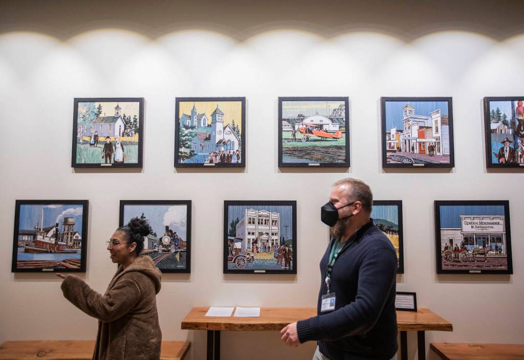 Art with scenes from around Marysville cover the wall inside the new Marysville Civic Center on Tuesday, in Marysville. (Olivia Vanni / The Herald)
