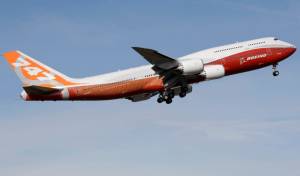 FILE - A Boeing 747-8, Boeing's new passenger plane, takes its first flight, Sunday, March 20, 2011, at Paine Field in Everett, Wash. After more than half a century, Boeing is rolling its last 747 out of a Washington state factory on Tuesday night. (AP Photo/Ted S. Warren, File)