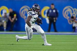 Seattle Seahawks running back Tony Jones Jr. runs with the ball during the second half of an NFL football game against the Los Angeles Rams Sunday, Dec. 4, 2022, in Inglewood, Calif. (AP Photo/Marcio Jose Sanchez)