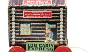Photo Caption: There's finding a toy in your food packaging, and then there's making a toy from the packaging. Towle's Log Cabin brand provided a rolling platform to turn their iconic syrup tin into a pull toy.