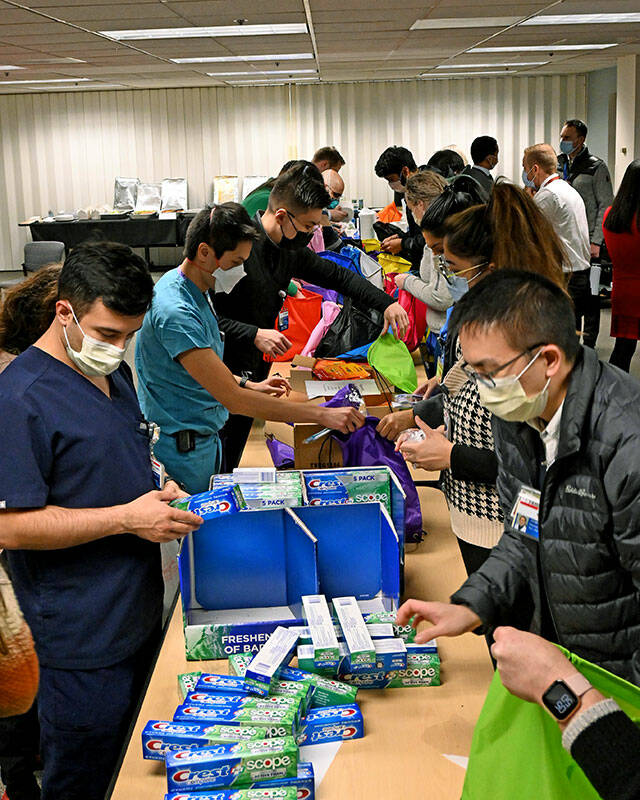 Providence-WSU residents assemble street medicine kits at Providence Regional Medical Center. (David Aufdencamp / Washington State University)