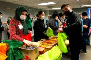 Providence-WSU residents assemble street medicine kits at Providence Regional Medical Center. (Joy Borkholder / The Herald)
