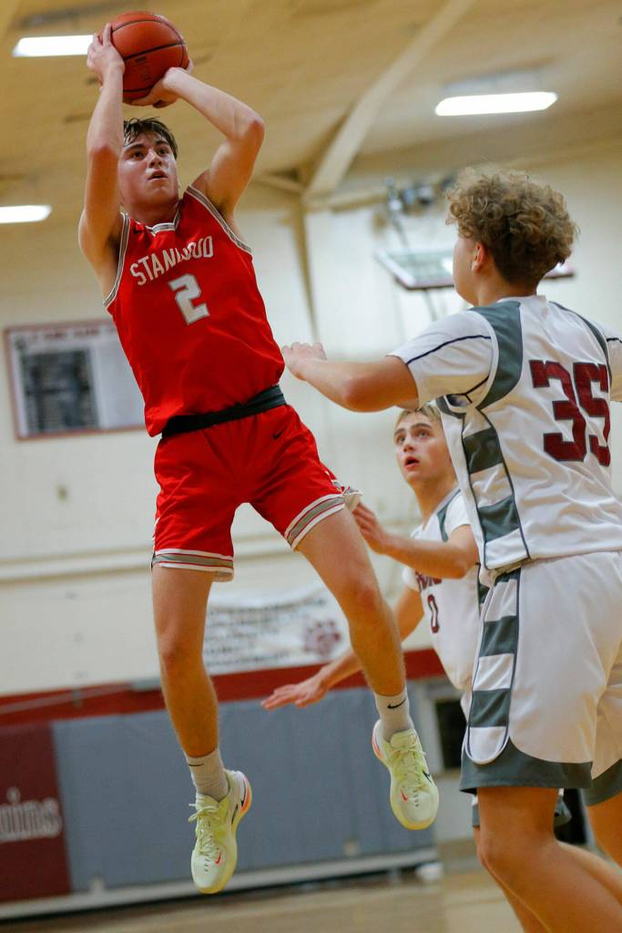 Stanwoods John Floyd shoots a jumper against Cascade on Thursday, Dec. 8, 2022, at Cascade High School in Everett, Washington. (Ryan Berry / The Herald)