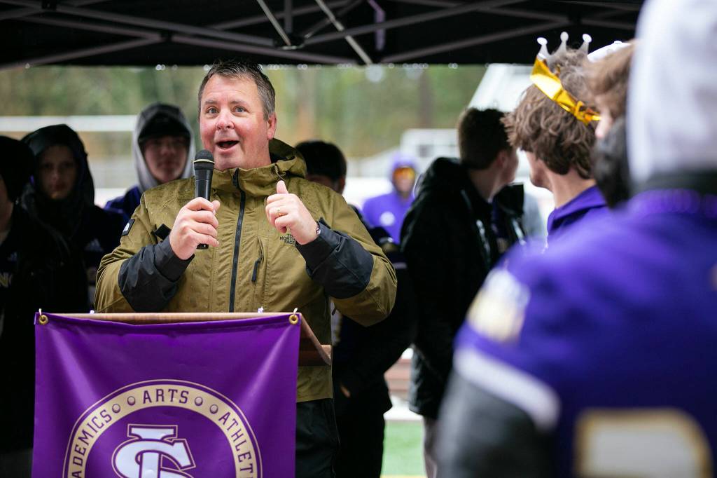 Dr. Ken Collins, superintendent of Lake Stevens School District, thanks members of the community for their involvement at the school during LSHSs 4A football championship parade Saturday, Dec. 10, 2022, in Lake Stevens, Washington. (Ryan Berry / The Herald)