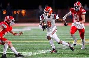 Lakes High School’s Aslan Fraser cuts through the secondary on a reception against Stanwood on Friday, Nov. 4, 2022, at Stanwood High School in Stanwood, Washington. (Ryan Berry / The Herald)