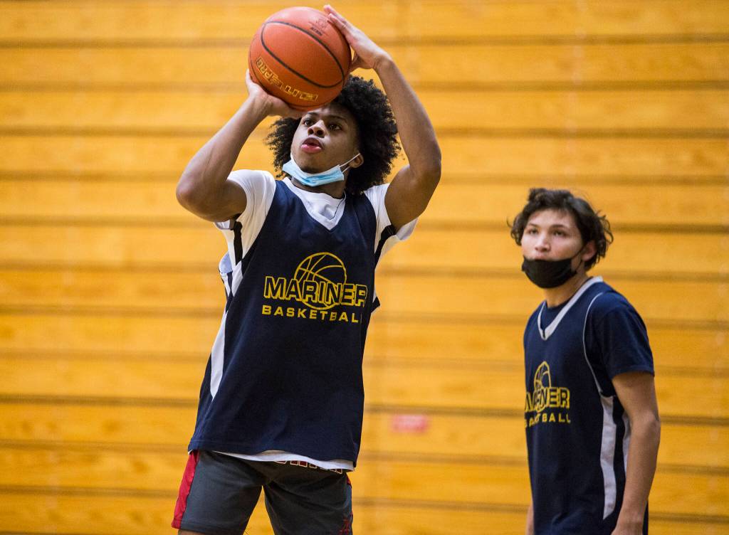 Jailin Johnson makes a 3-point shot during a Feb. 10 practice at Mariner High School in Everett. (Olivia Vanni / The Herald)