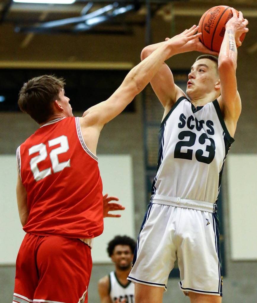 Shorecrests Parker Baumann attempts a shot against Stanwood on Jan. 13 in Shoreline. (Kevin Clark / The Herald)