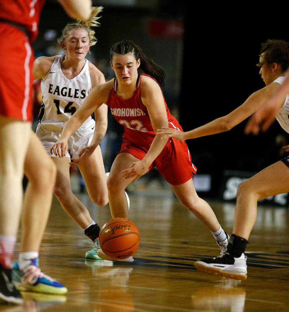 Snohomishs Jada Andresen tries to navigate through the defense against Arlington during a 3A state quarterfinal on March 3 at the Tacoma Dome. (Ryan Berry / The Herald)