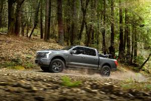 2022 Ford F-150 Lightning Lariat. Pre-production model with available features shown. Available starting spring 2022. Always consult the owner’s manual before off-road driving, know your terrain and trail difficulty and use appropriate safety gear.