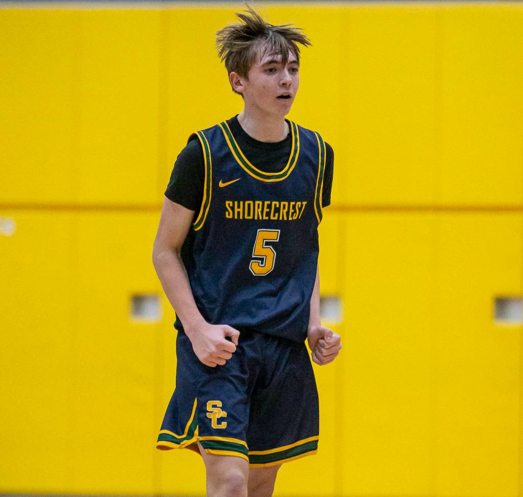 Shorecrests Brayden Fischer reacts to hitting a 3-point shot during the game against Marysville Getchell on Friday, Dec. 16, 2022 in Marysville, Washington. (Olivia Vanni / The Herald)