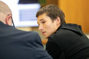 Dakotah Allett speaks with his lawyer before being sentenced Wednesday, Dec. 28, 2022, at Snohomish County Superior Court in Everett, Washington. (Ryan Berry / The Herald)