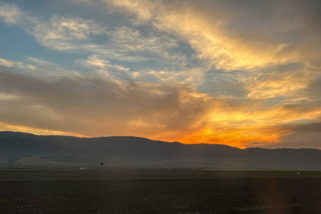 Watching the sun set over Soledad, California, and desperately craving Chipotle. (Julia Carmel / Los Angeles Times)