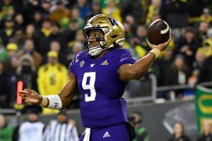 Washington quarterback Michael Penix Jr. (9) passes against Oregon during the second half of an NCAA college football game Saturday, Nov. 12, 2022, in Eugene, Ore. (AP Photo/Andy Nelson)