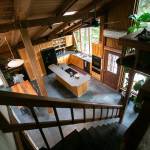 The view down from the bedroom in Cabin 1 looks down into the kitchen. (Ryan Berry / The Herald)