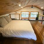 A lofted space holds a bed in one of the three cabins at Canyon Creek Cabins on Sep. 23 in Granite Falls. (Ryan Berry / The Herald)