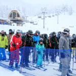 Patrons wait their turn for a chair on the lift at Stevens Pass Thursday afternoon on December 30, 2021. (Kevin Clark / The Herald)