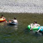 Teenagers tube the waters of the Pilchuck River Wednesday afternoon in Snohomish, Washington on July 20, 2022. (Kevin Clark / The Herald)