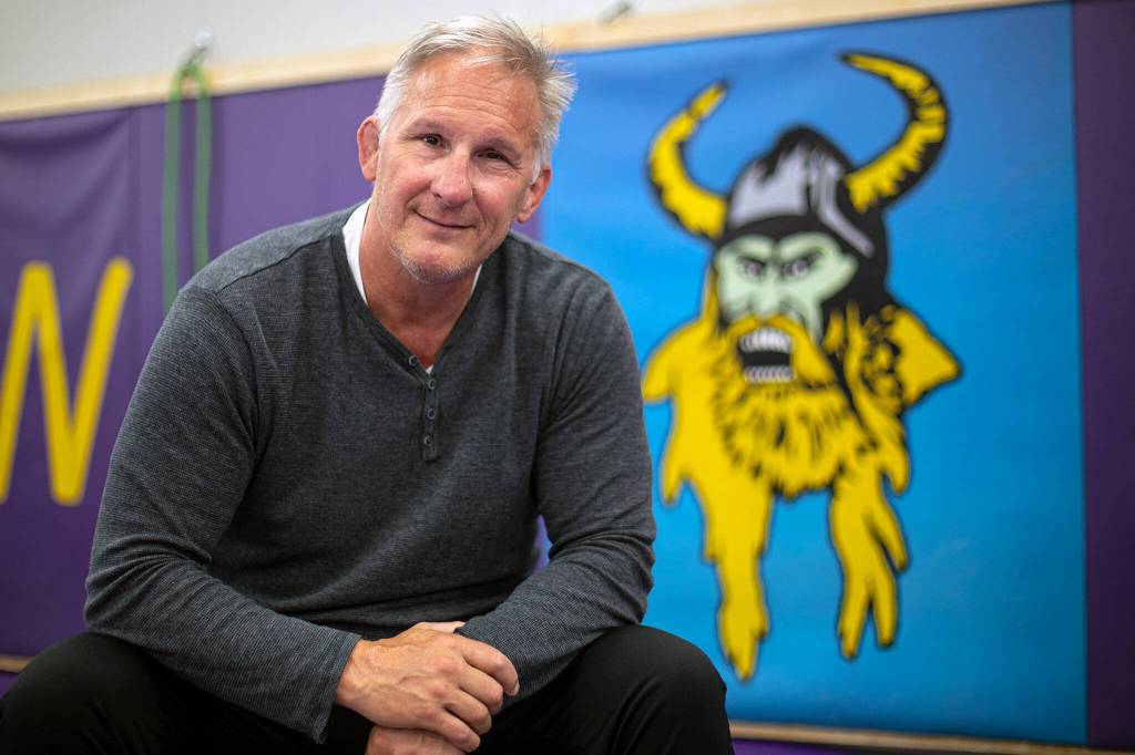 Brent Barnes, who coached Lake Stevens High School wrestling for more than three decades, sits in the school’s wrestling room Tuesday, April 12, 2022, in Lake Stevens, Washington. (Ryan Berry / The Herald)