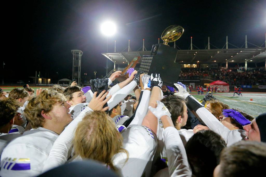 Lake Stevens celebrates winning the Class 4A state championship Dec. 3, 2022, at Mount Tahoma Stadium in Tacoma. (Ryan Berry / The Herald)