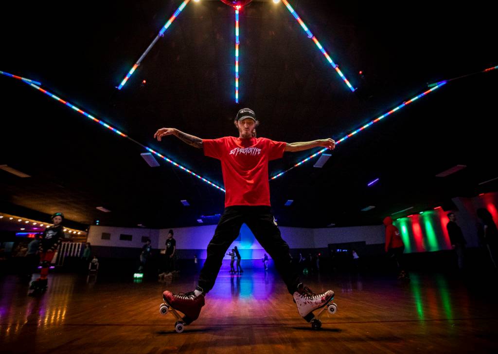 Joseph Cordell, a longtime patron of the Everett Skate Deck, demonstrates some of his skate moves during the final open skate session at the Everett Skate Deck before its permanent closure on Sunday, April 3, 2022. (Olivia Vanni / The Herald)