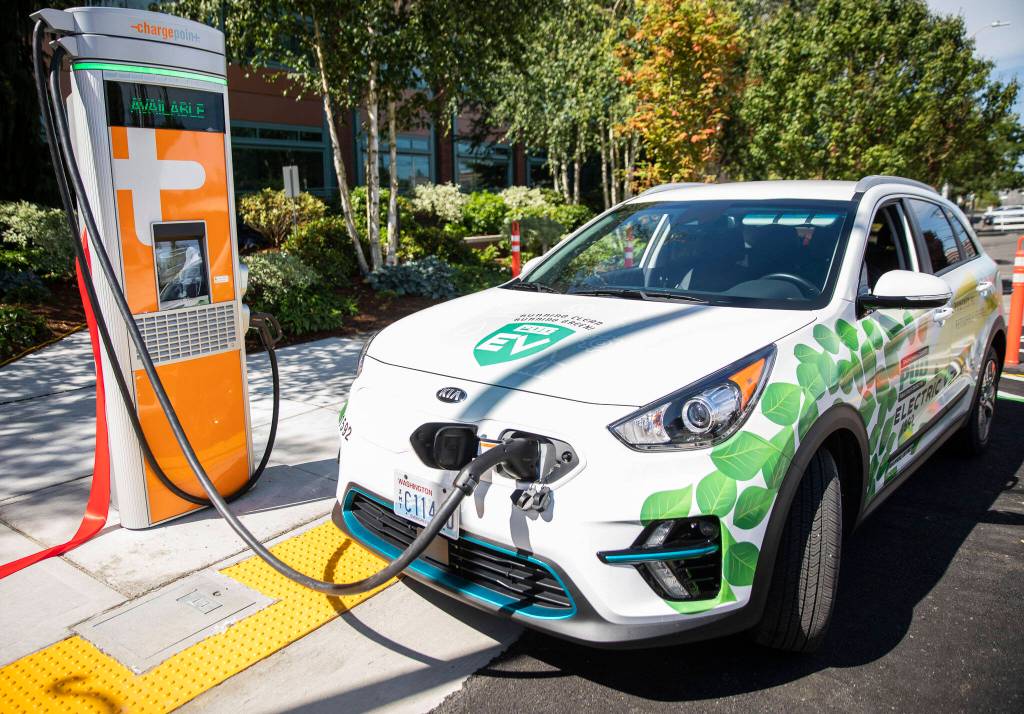 Two EV charging stations are unveiled at a ribbon cutting outside of PUD headquarters on Wednesday, July 13, 2022 in Everett, Washington. (Olivia Vanni / The Herald)