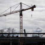 Crews work on the Lynnwood light rail station Tuesday in Lynnwood. (Olivia Vanni / The Herald)