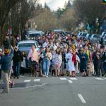 Plungers march down Main Street as they head for the waterfront during the 2023 Edmonds Polar Bear Plunge on Sunday, Jan. 1, 2023, at Bracketts Landing in Edmonds, Washington. (Ryan Berry / The Herald)