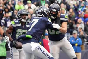 Seattle Seahawks tight end Tyler Mabry, right, celebrates his touchdown with quarterback Geno Smith (7) during the first half of an NFL football game against the New York Jets, Sunday, Jan. 1, 2023, in Seattle. (AP Photo/Ted S. Warren)