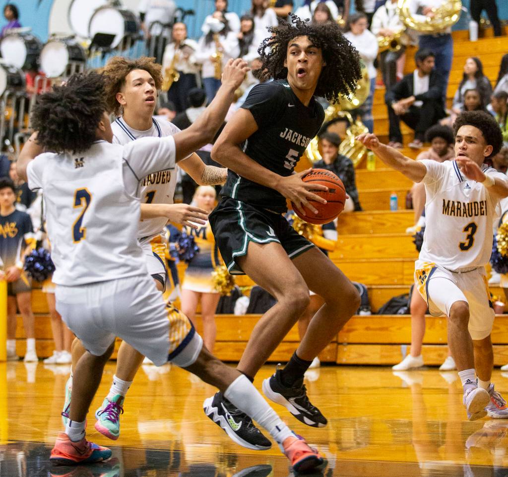 Jacksons Sylas Williams posts up with the ball during a game against Mariner on Wednesday in Everett. (Olivia Vanni / The Herald)