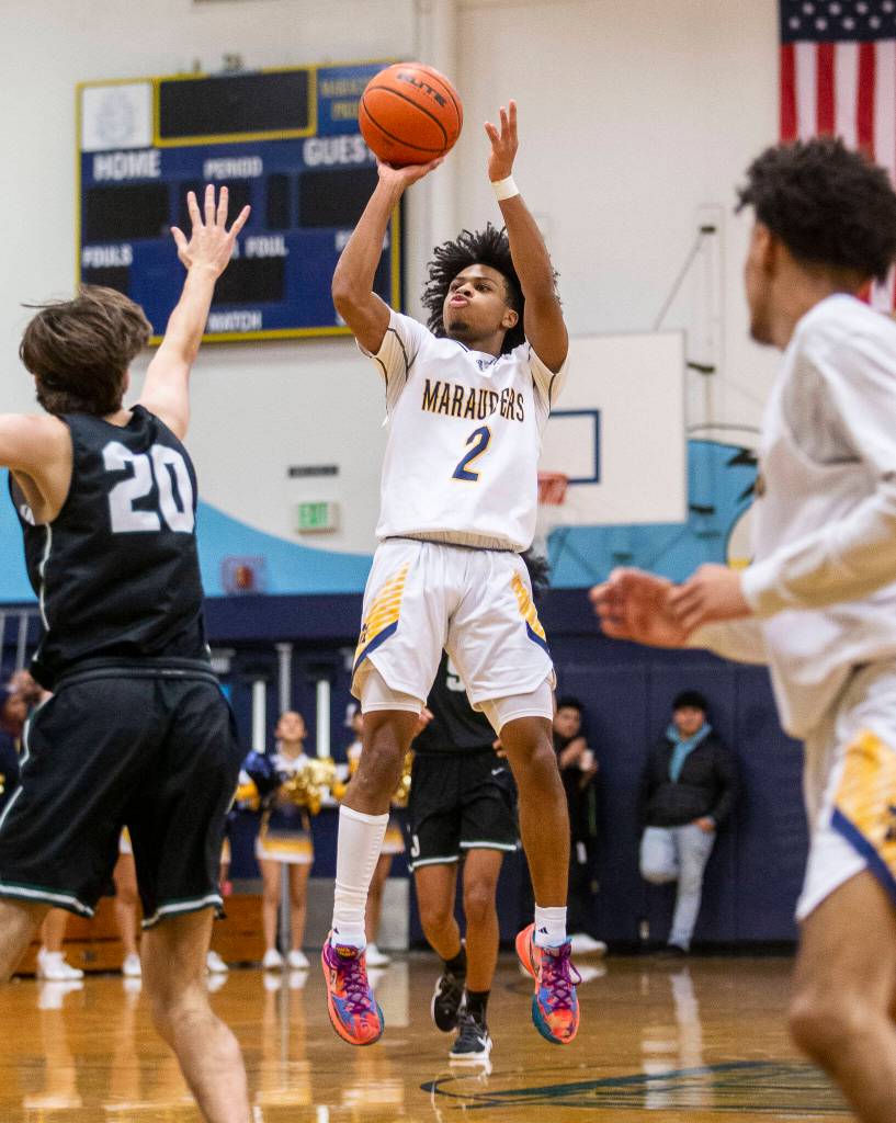 Mariners Jailin Johnson makes a 3-point shot during the game against Jackson on Wednesday in Everett. (Olivia Vanni / The Herald)