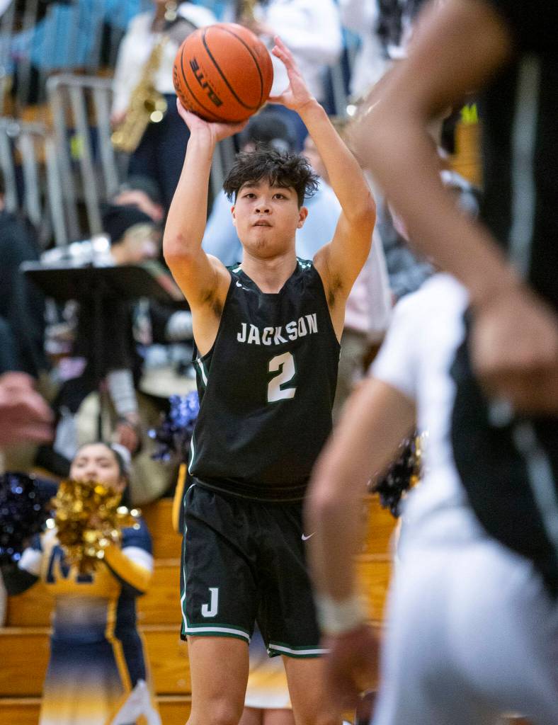 Jacksons Harris Kampe makes a 3-point shot during the game against Mariner on Wednesday in Everett. (Olivia Vanni / The Herald)