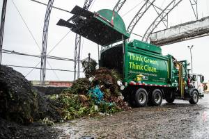 A Waste Management truck dumps a load of compostable waste at Cedar Grove Composting on Thursday, Jan. 12, 2023 in Everett, Washington. (Olivia Vanni / The Herald)
