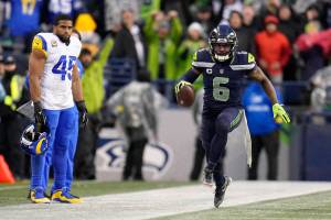 Seattle Seahawks safety Quandre Diggs (6) celebrates after intercepting a pass as Los Angeles Rams linebacker Bobby Wagner (45), left, looks on during overtime of an NFL football game Sunday, Jan. 8, 2023, in Seattle. (AP Photo/Abbie Parr)