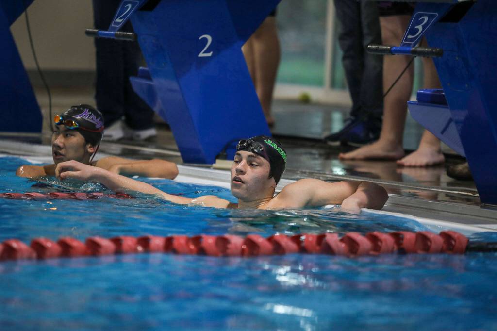Jacksons Ethan Georgiev catches his breath after winning the fourth heat of the 500 yard freestyle race during the Jackson vs. Kamiak boys swim and dive meet at West Coast Aquatics in Mill Creek, Washington on Tuesday Jan. 10, 2023. (Annie Barker / The Herald)