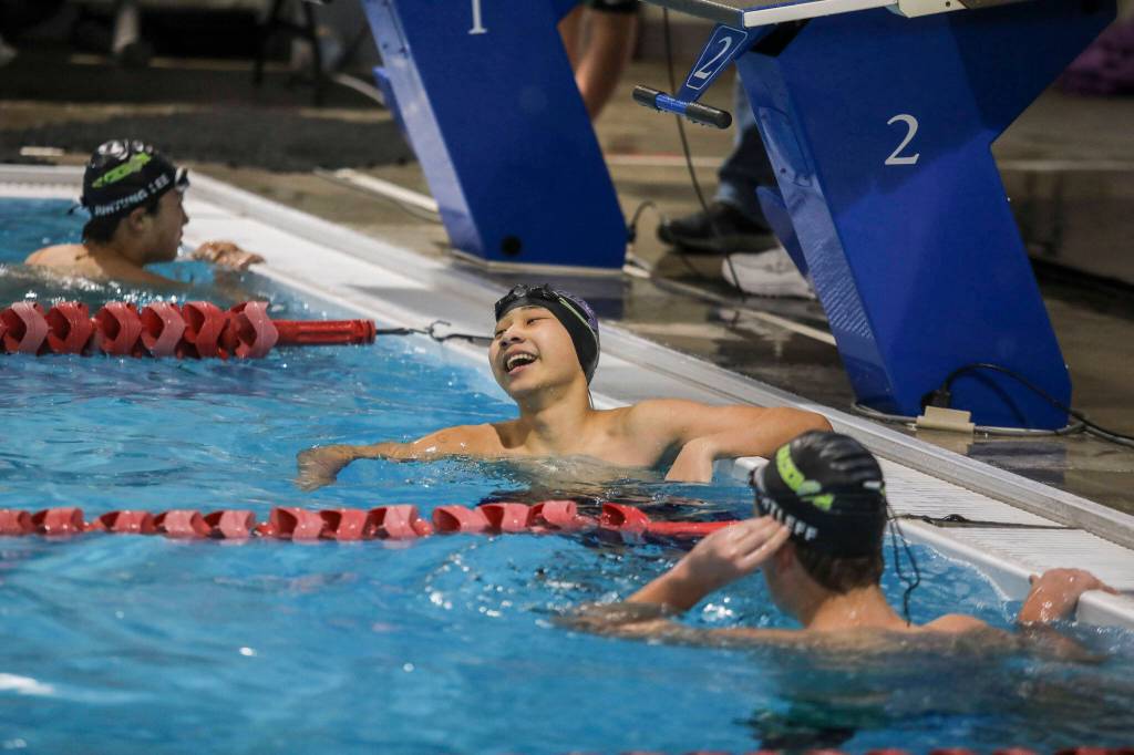 Kamiaks Ryan Chai reacts to winning heat two of the 100 yard backstroke during the Jackson vs. Kamiak boys swim and dive meet at West Coast Aquatics in Mill Creek, Washington on Tuesday Jan. 10, 2023. (Annie Barker / The Herald)