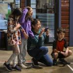 Attendees cheer and watch during the Jackson vs. Kamiak boys swim and dive meet at West Coast Aquatics in Mill Creek, Washington on Tuesday Jan. 10, 2023. (Annie Barker / The Herald)