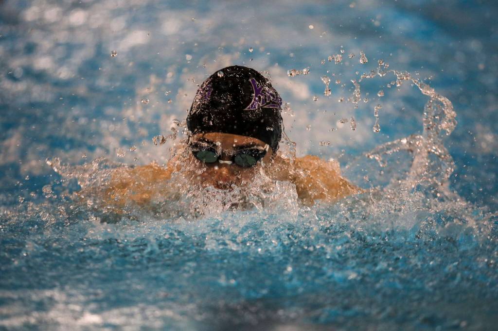 Kamiaks Tsuyoshi Kameda participates in and wins the second heat of the 100 yard butterfly race during the Jackson vs. Kamiak boys swim and dive meet at West Coast Aquatics in Mill Creek, Washington on Tuesday Jan. 10, 2023. (Annie Barker / The Herald)