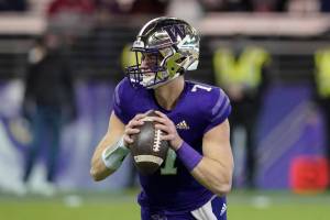 Washington quarterbacks Sam Huard (7) during an NCAA college football game against Washington State, Friday, Nov. 26, 2021, in Seattle. (AP Photo/Ted S. Warren)