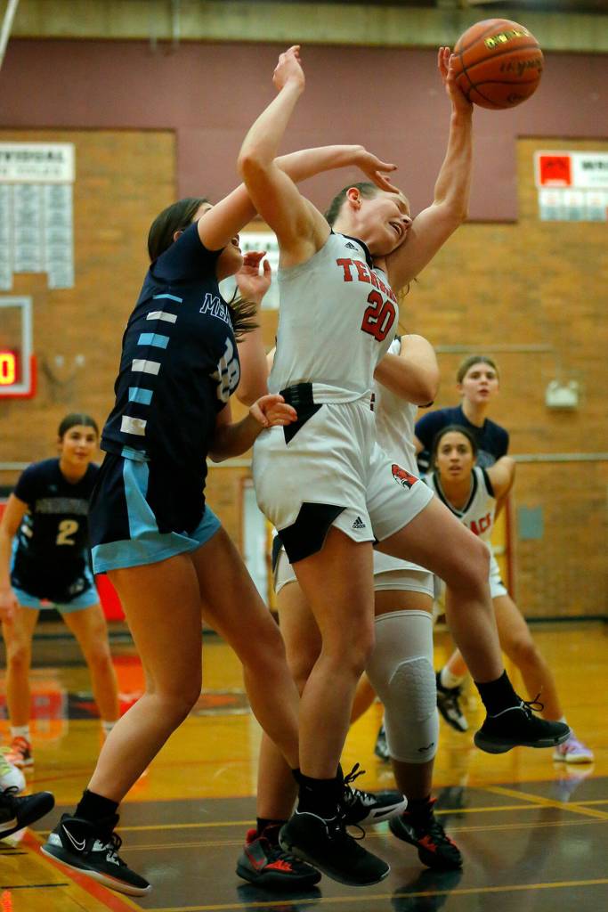 Mountlake Terraces Cameron Dunn gets fouled while trying to come down with a rebound against Meadowdale on Wednesday, Jan.11, 2023, at Mountlake Terrace High School in Mountlake Terrace, Washington. (Ryan Berry / The Herald)