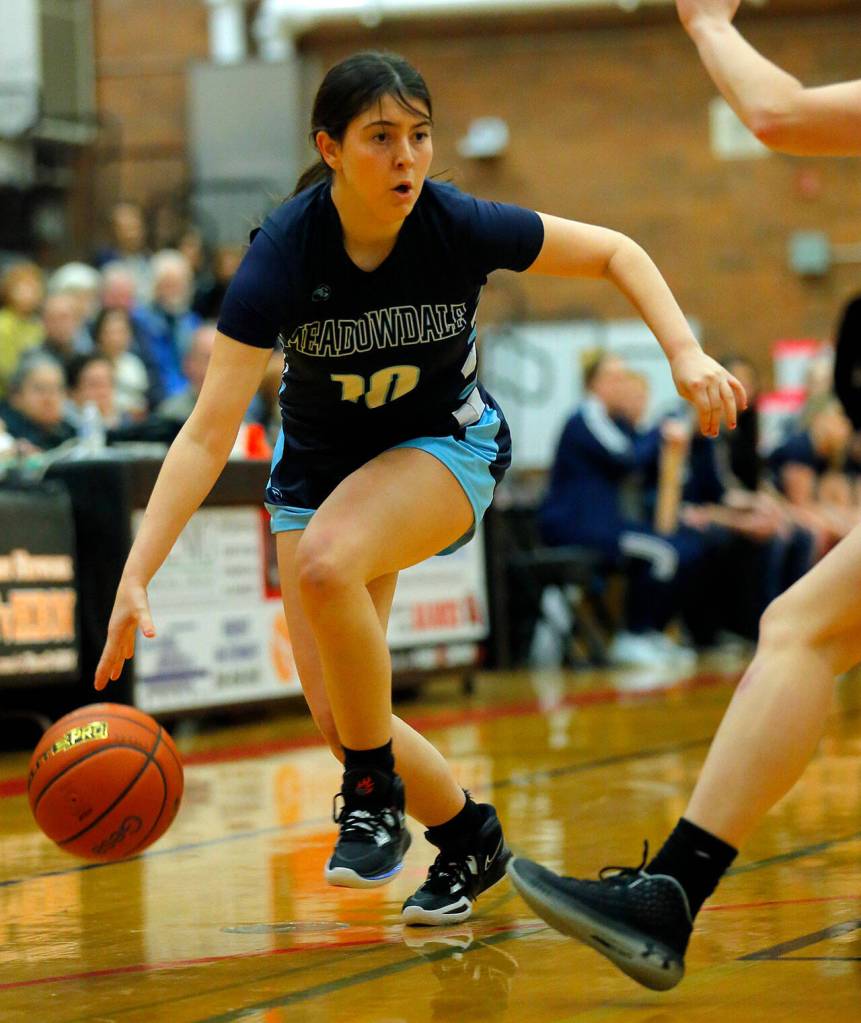 Meadowdales Natalie Durbin tries to take the ball to the baseline against Mountlake Terrace on Wednesday, Jan.11, 2023, at Mountlake Terrace High School in Mountlake Terrace, Washington. (Ryan Berry / The Herald)
