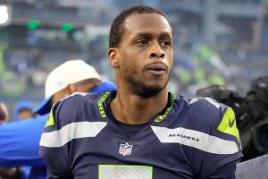 Seattle Seahawks quarterback Geno Smith (7) walks off the field after an NFL football game against the Los Angeles Rams, Sunday, Jan. 8, 2023, in Seattle, WA. The Seahawks defeated the Rams in overtime 19-16. (AP Photo/Ben VanHouten)