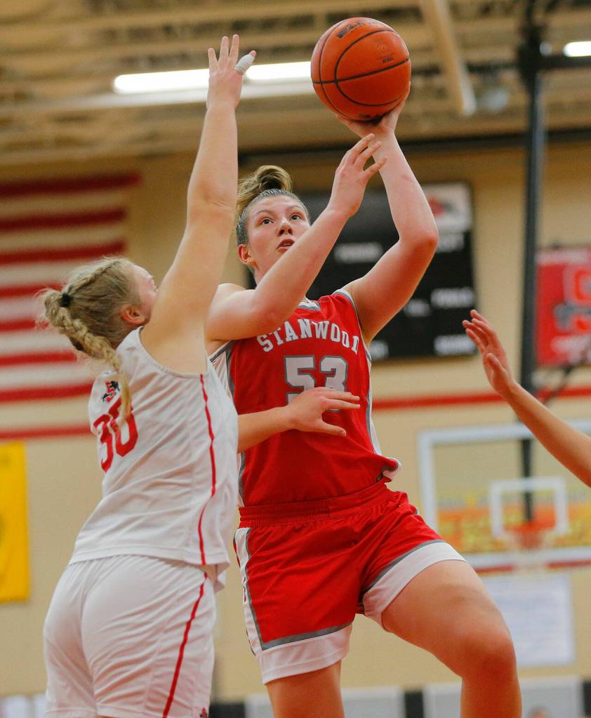 Stanwoods Vivienne Berrett scores a basket against Snohomish on Friday, Jan. 13, 2023, at Snohomish High School in Snohomish, Washington. (Ryan Berry / The Herald)