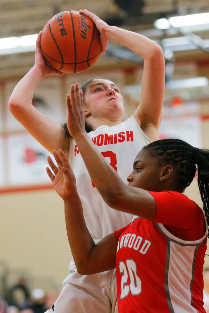 Snohomishs Sienna Capelli gets around a defender in the air for a layup against Stanwood on Friday, Jan. 13, 2023, at Snohomish High School in Snohomish, Washington. (Ryan Berry / The Herald)