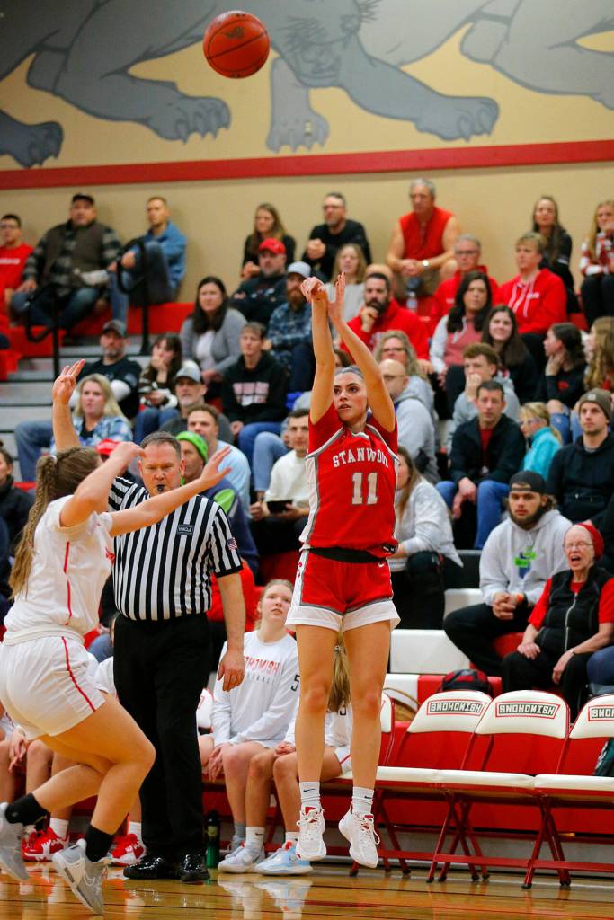 Stanwoods Tatum Brager launch a three against Snohomish on Friday, Jan. 13, 2023, at Snohomish High School in Snohomish, Washington. (Ryan Berry / The Herald)