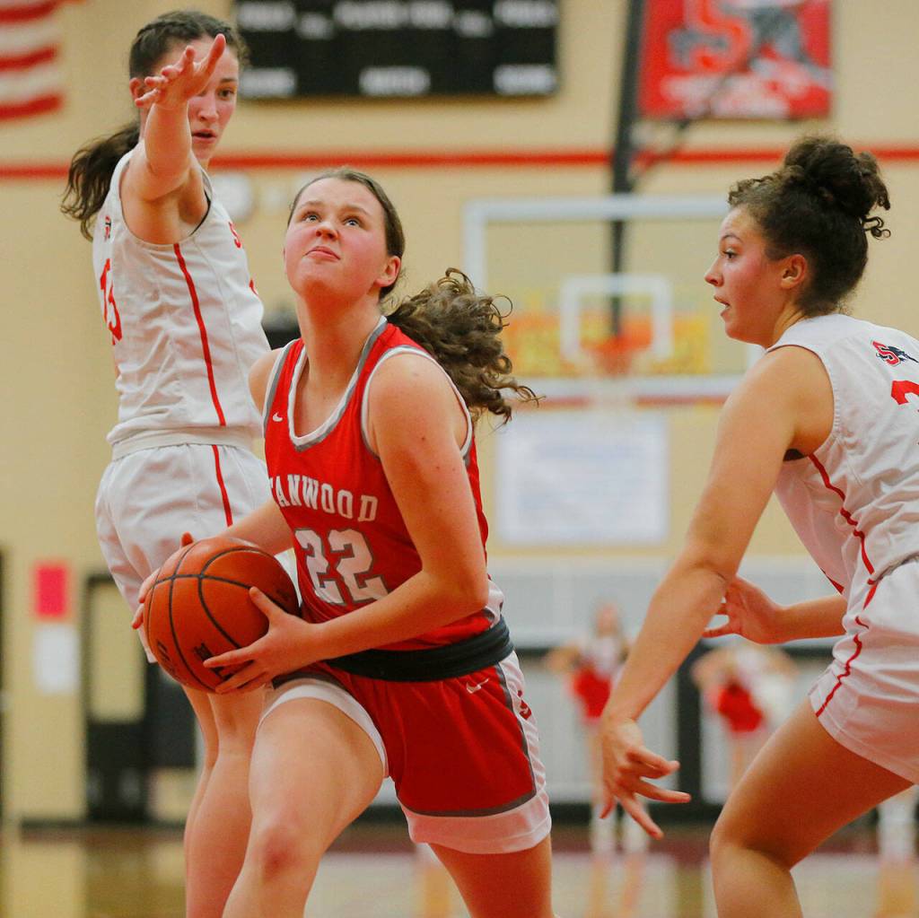 Stanwoods Jazmyn Legg weaves past a defender against Snohomish on Friday, Jan. 13, 2023, at Snohomish High School in Snohomish, Washington. (Ryan Berry / The Herald)