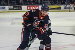 Kamloops’ Ryan Hofer (10) and Silvertips’ Beau Courtney (10) fight for the puck during a game between the Silvertips and Kamloops Blazers at the Angel of the Winds Arena on Friday, Jan. 13, 2023. The Silvertips fell to the Kamloops, 3-6. (Annie Barker / The Herald)
