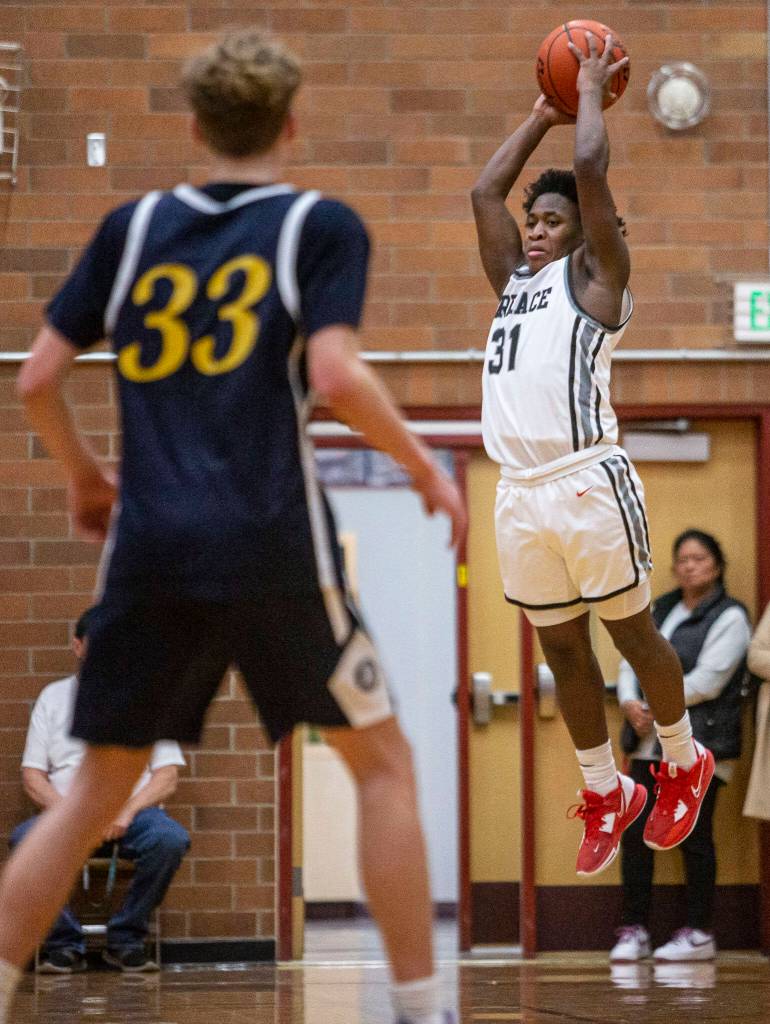 Mountlake Terraces Rayshuan Connor leaps in the air to catch a high pass during the game against Everett on Tuesday, Jan. 17, 2023 in Mountlake Terrace, Washington. (Olivia Vanni / The Herald)